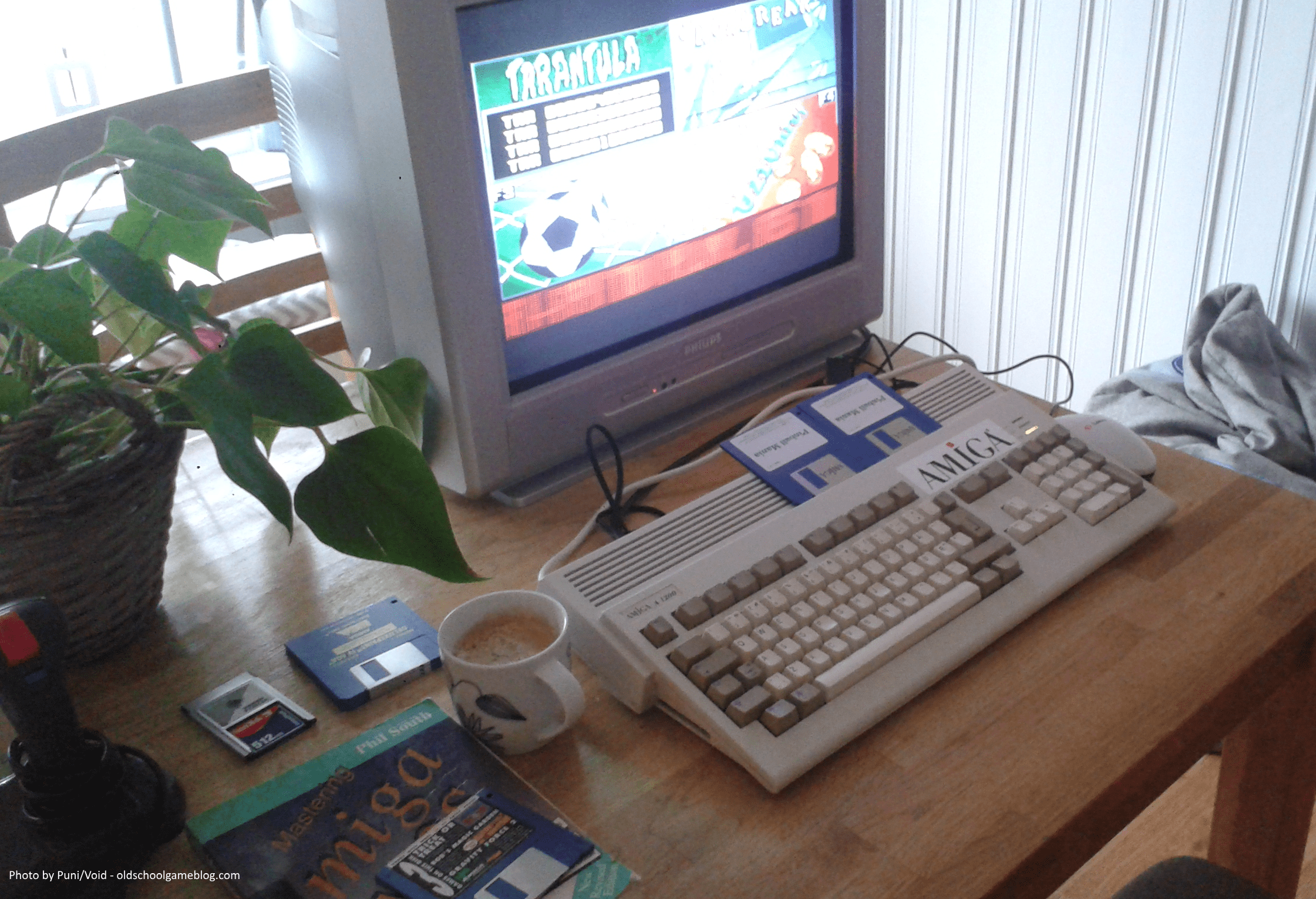 Photo of my Amiga 1200 in action running Pinball Mania. You can also see Phil South's excellent AMOS book on the left hand side. :)